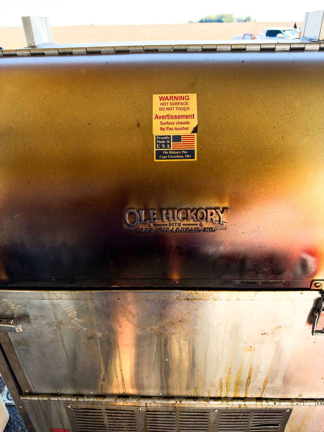 The Ole Hickory smoker on the trailer, seasoned from use