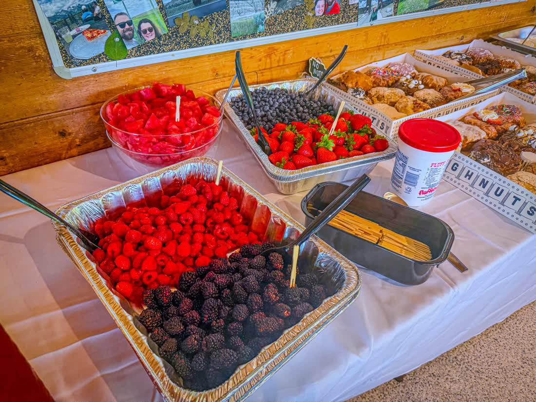 Fresh berries, watermelon, and a donut spread for dessert