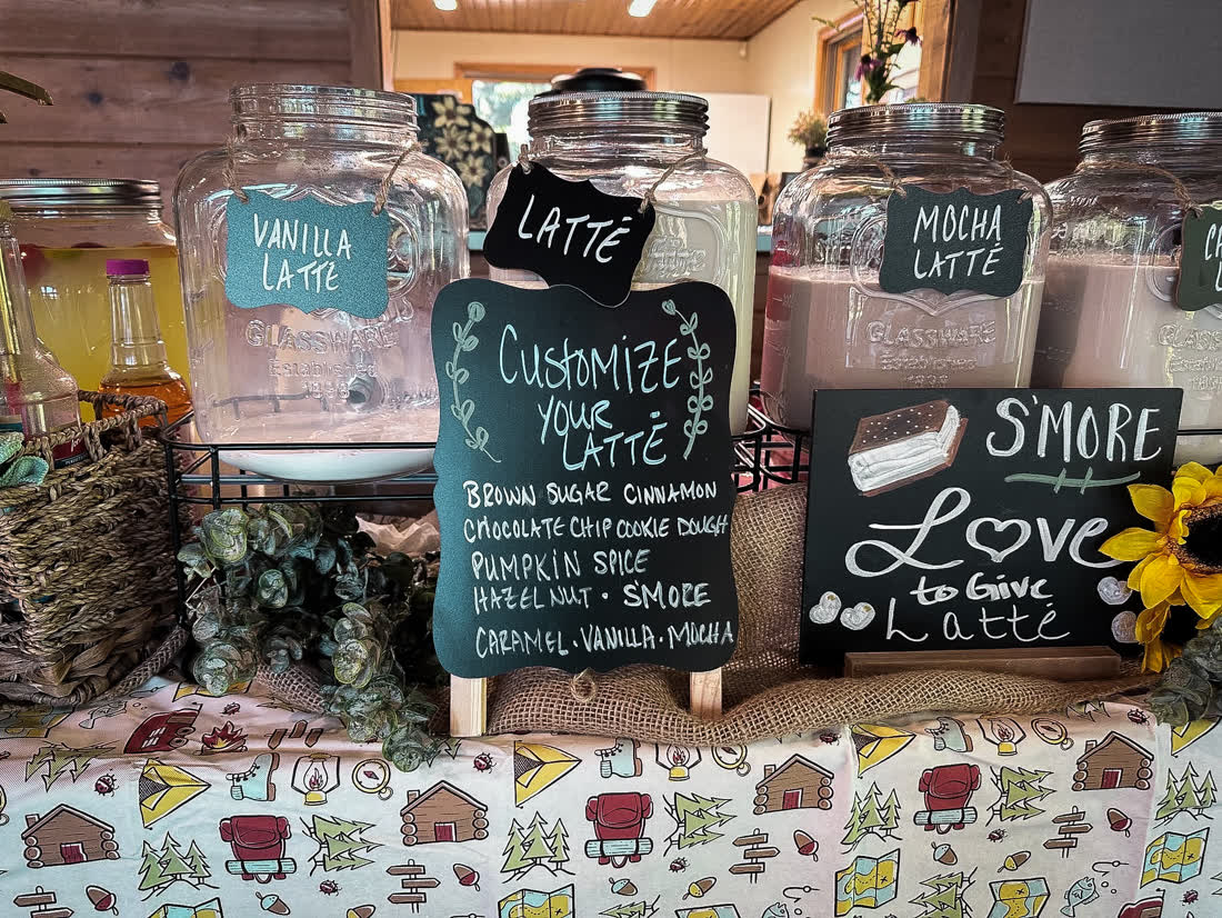 Vanilla, mocha, and caramel latte jars with a customize-your-latte sign